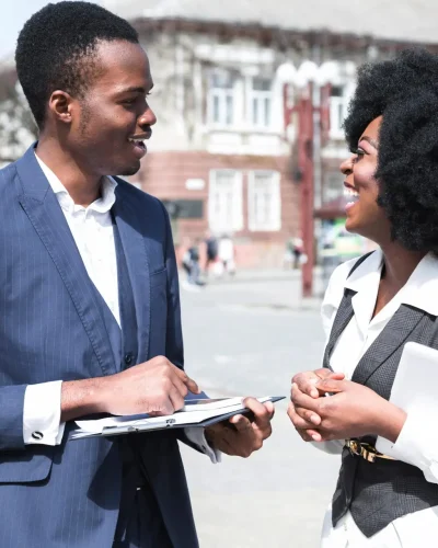 portrait-african-young-businessman-businesswoman-talking-each-other-city